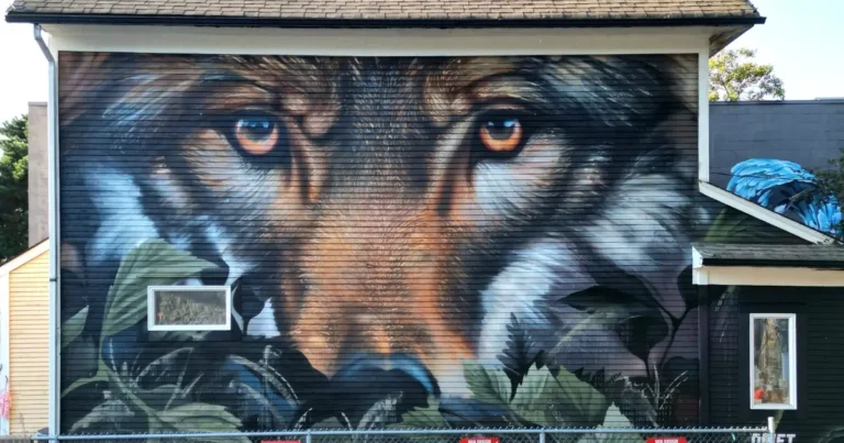 A picture depicting a mural of a wolf on the side of a building in Vancouver.