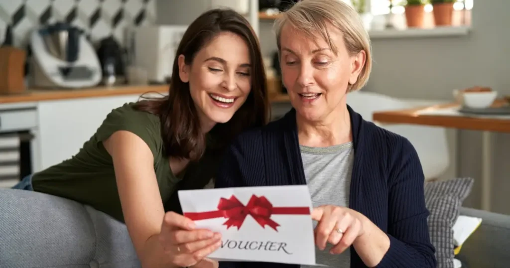 Picture showing two women with a gift certificate